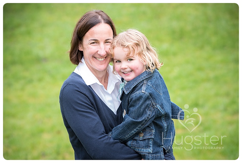 Mum carrying daughter in the park